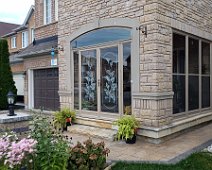 Porch enclosure with an arch, doors design